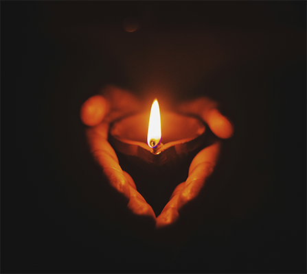 hand holding candles