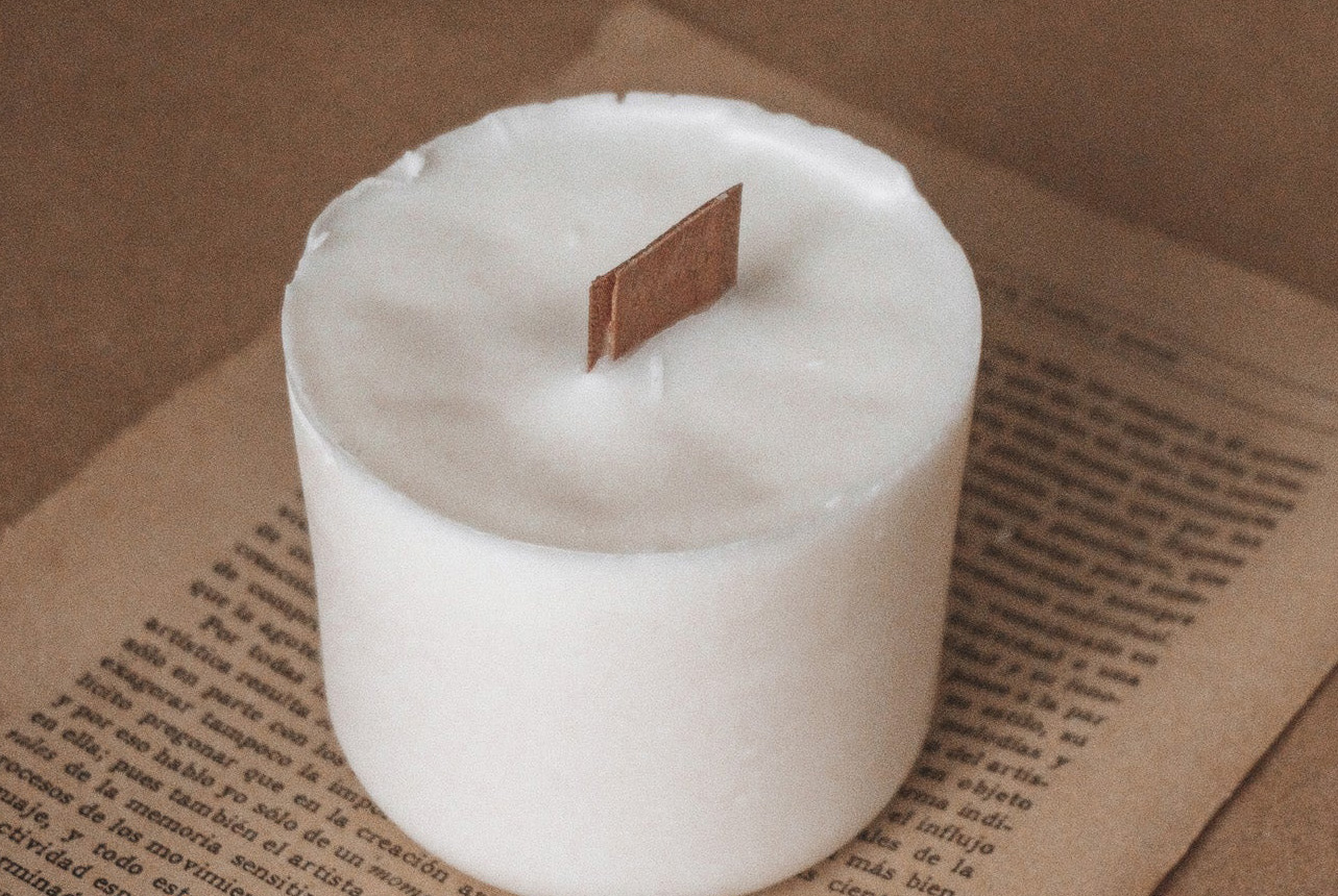 hand over candle glowing in the light